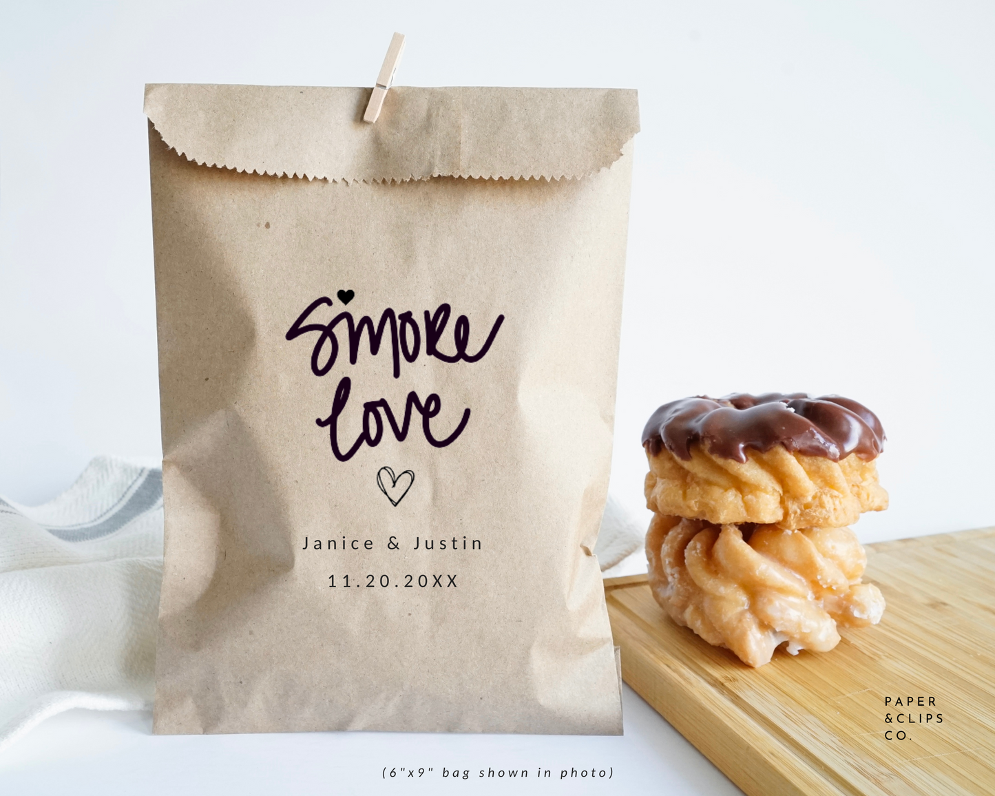 Personalized paper favor bag, laser printed with our signature hand lettering “s'more love” and custom names and date below. Perfect for s'more favors!