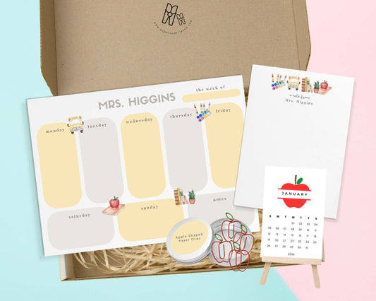 Looking for a one-of-a-kind personalized gift set for a teacher, professor, principal or yourself? Put a smile on someone's face with our custom stationery gift set. This set includes a 8.5"x5.5" weekly planner and 4.25" x 5.5" custom name notepad, a mini desk calendar, and a pack of apple-shaped paperclips.