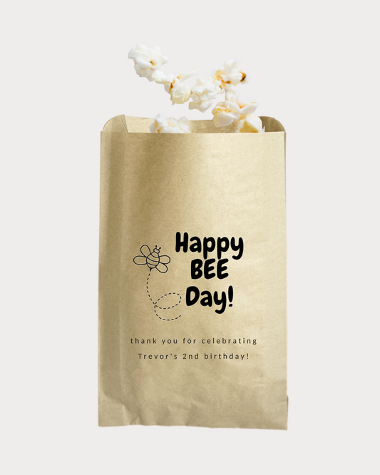 Personalized Happy "Bee" Day party favor bags. Perfect for celebrating a party with the bumblebee theme. Bags are available in two sizes - 5x8" and 6x9" in kraft brown color.