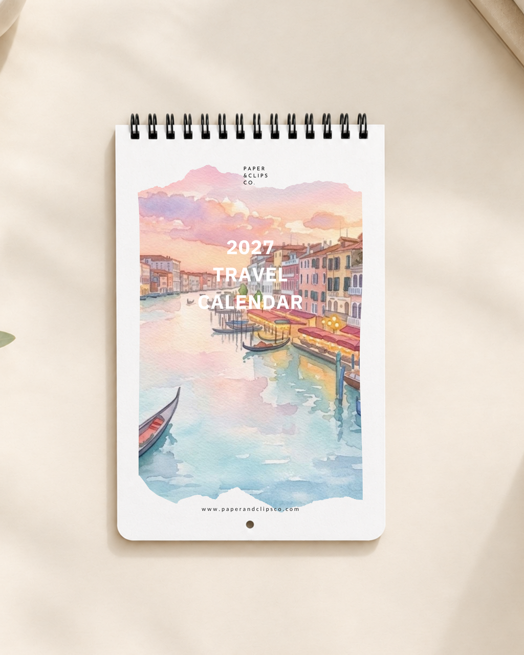 2027 travel calendar with pre-punched hole for easy hanging. Vivid colors of countries around the world. Perfect for travellers. Made by Paper and Clips Co.