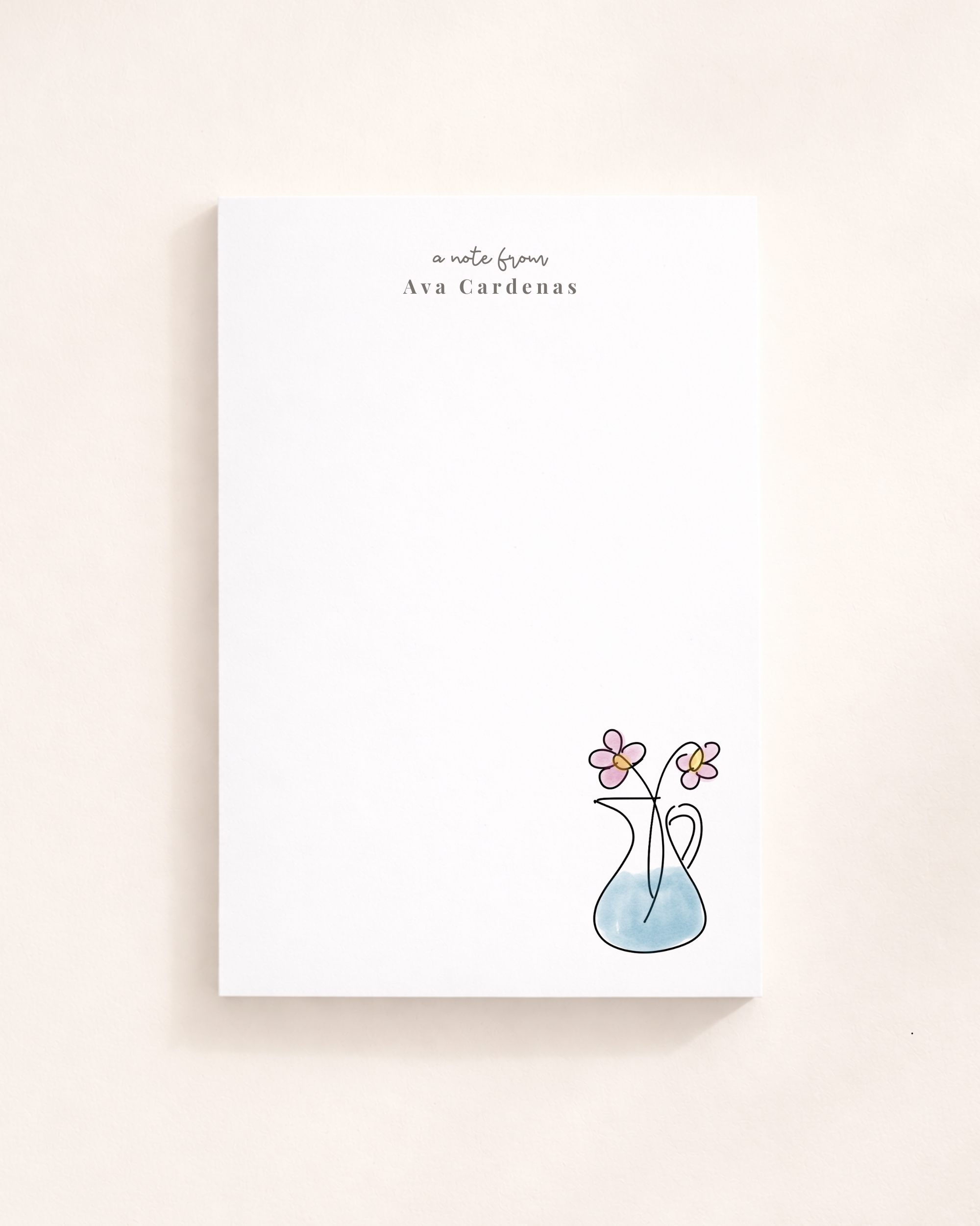 Personalized floral notepad with custom name and minimalist vase flower illustration on a clean white stationery pad.