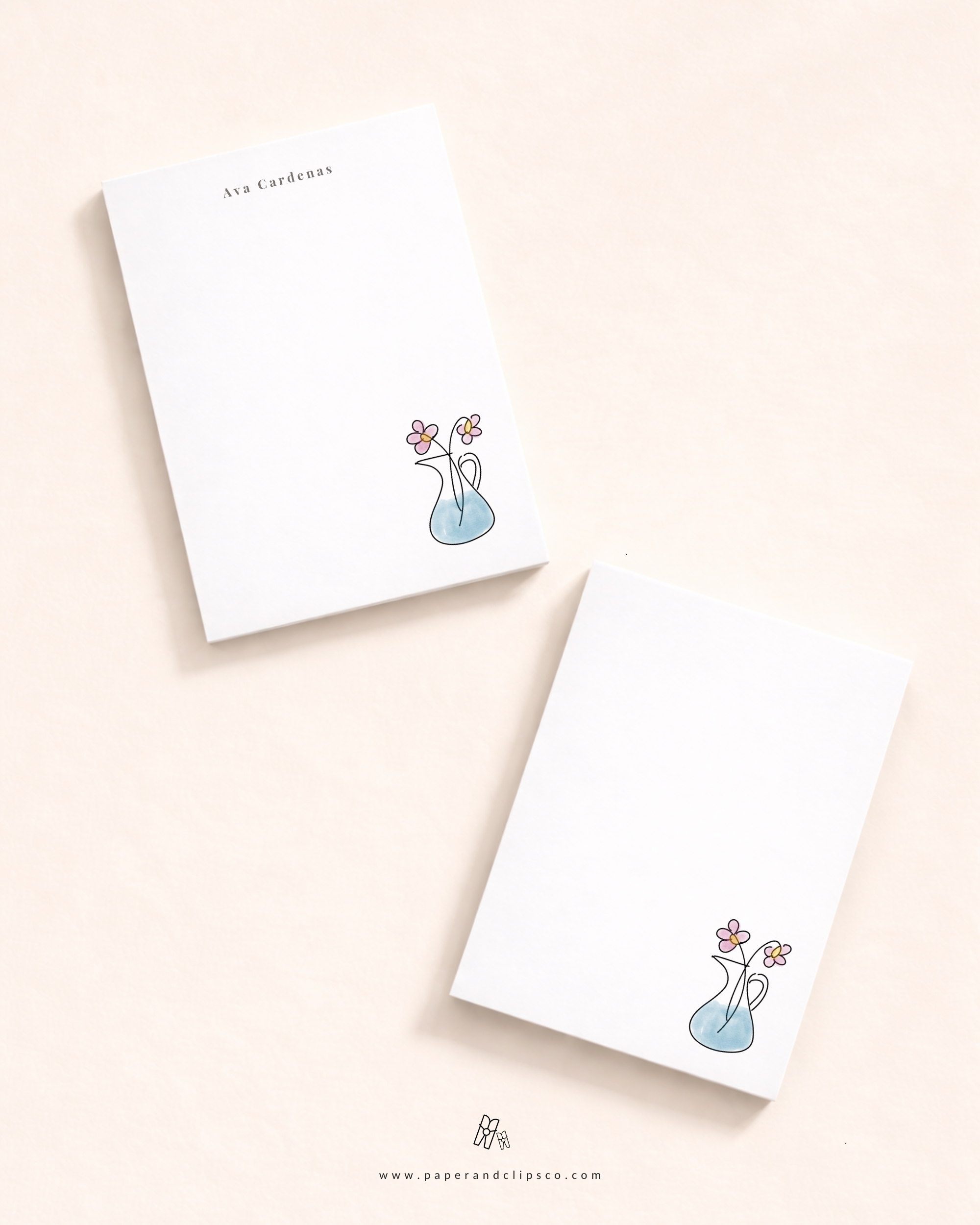 Personalized floral notepad with custom name and minimalist vase flower illustration on a clean white stationery pad.