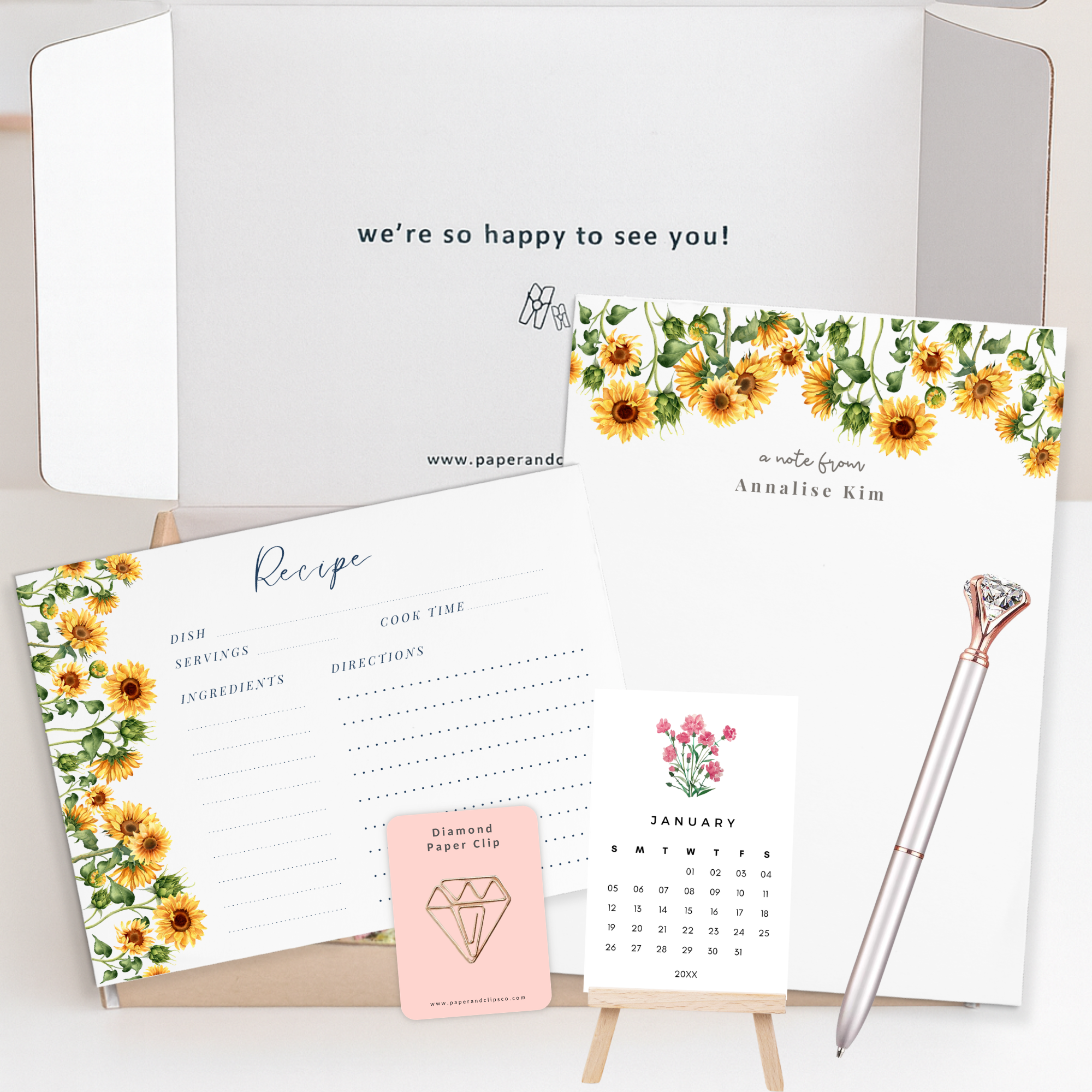 Custom floral stationery gift set featuring personalized 5.5x8.5 notepad, 12 floral recipe cards, mini desk calendar with easel, diamond pen and paper clip.