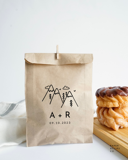 Personalized paper favor bag, with laser printed mountain image and custom initials and date or message below.