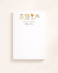 A vertical white notepad featuring watercolor illustrations of a tea kettle, stand mixer, wooden spoons, and a hand mixer.